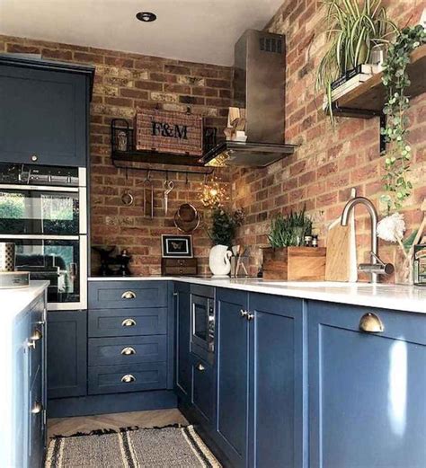 blue cabinets with brick backsplash.